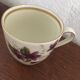 Two porcelain cups with violets