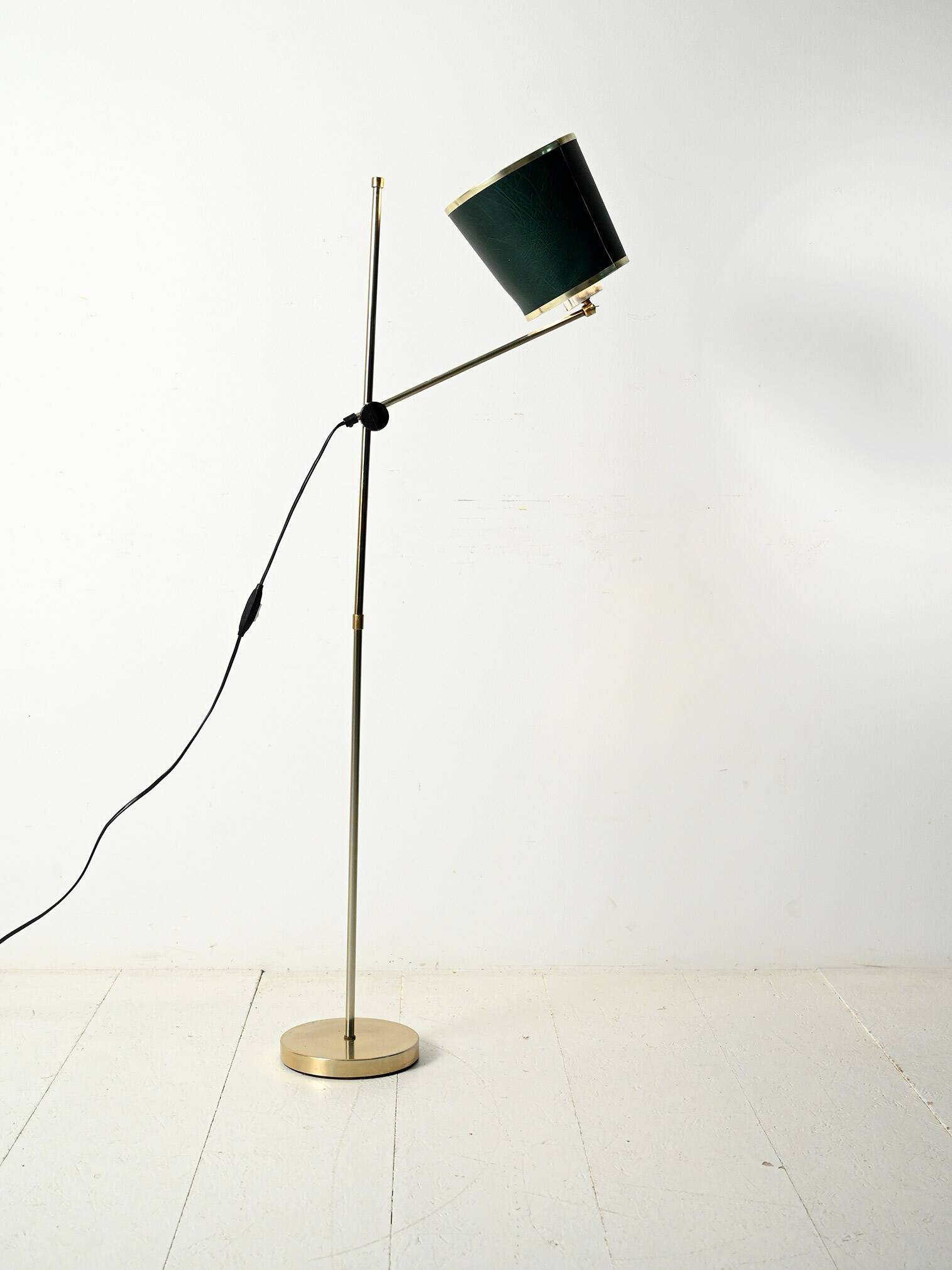 Brass floor lamp with green leather