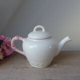 Old ceramic teapot in the shape of a basket of fruits from the garden