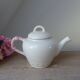 Old ceramic teapot in the shape of a basket of fruits from the garden