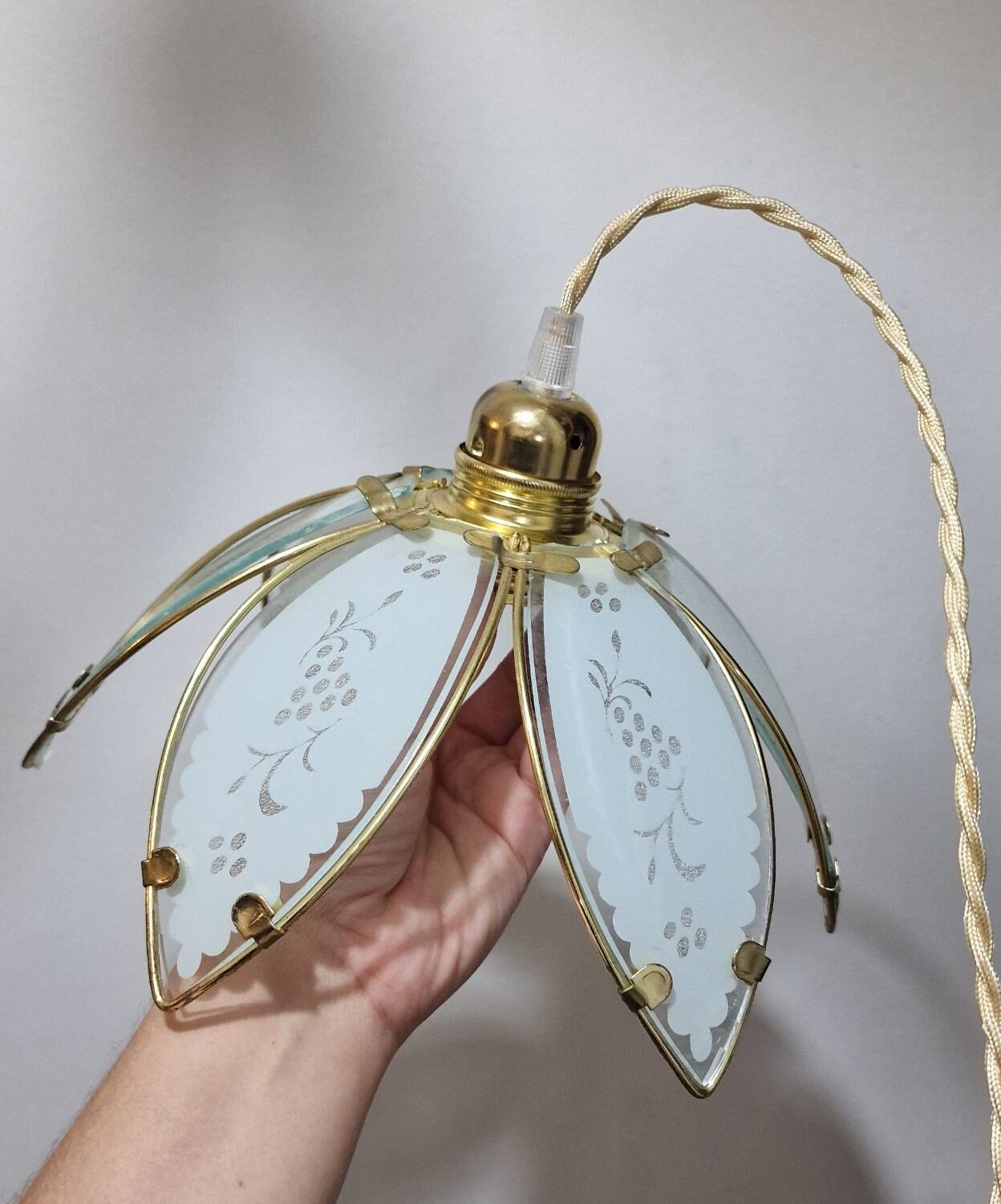 Glass flower rimmed with brass