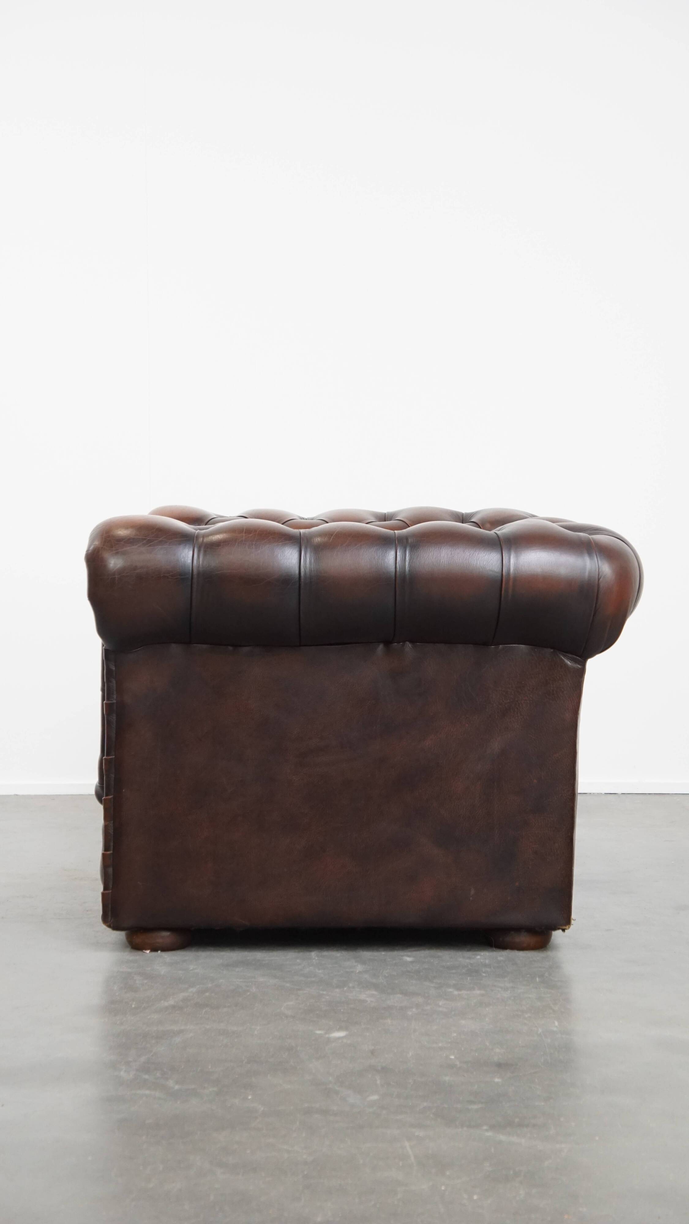 Dark brown English cowhide leather chesterfield armchair