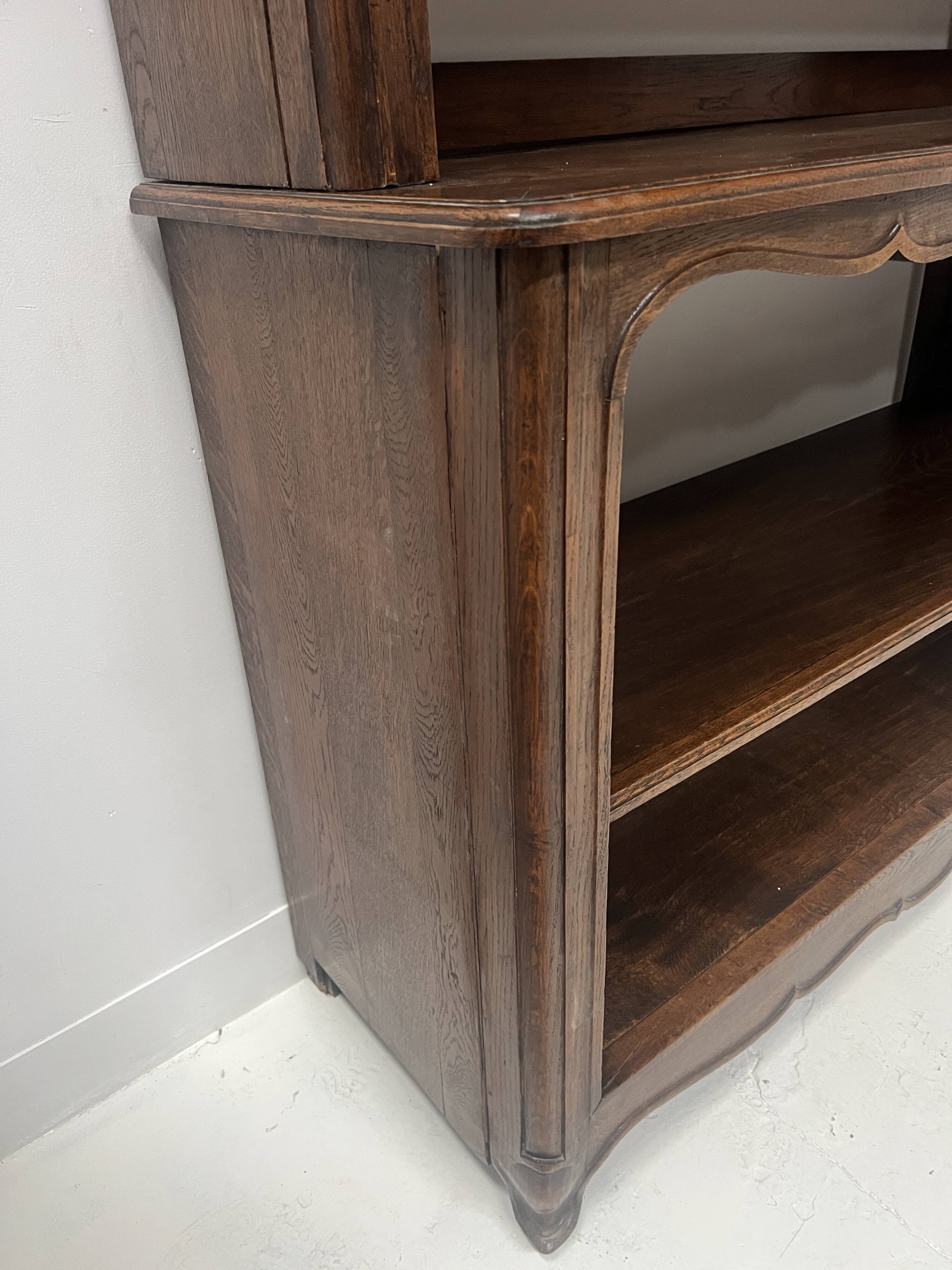 Wall library in two sections in Louis XV style made of solid oak, 20th century.