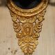 Pair of L'Originale wall sconces plated with 24-carat gold featuring four bronze candles.