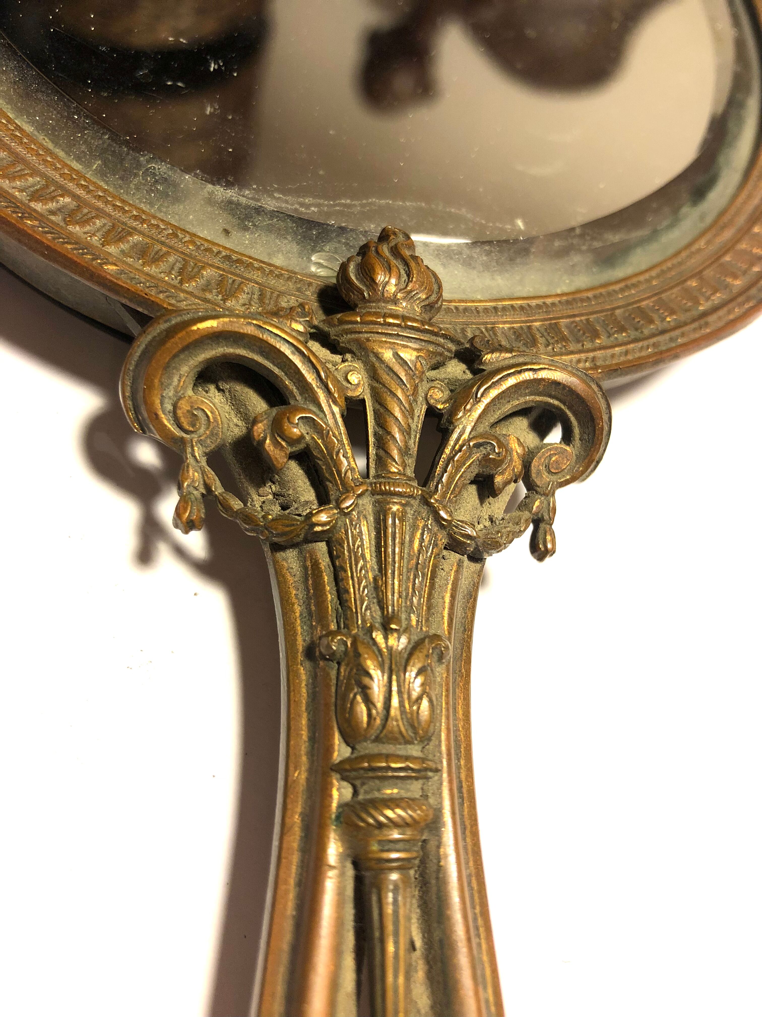 Courtesy hand mirror