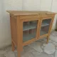 Art Deco sideboard in raw wood with a wax finish, closed by 2 glass doors.