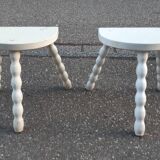 Duo of milking stools with turned legs.