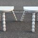 Duo of milking stools with turned legs.