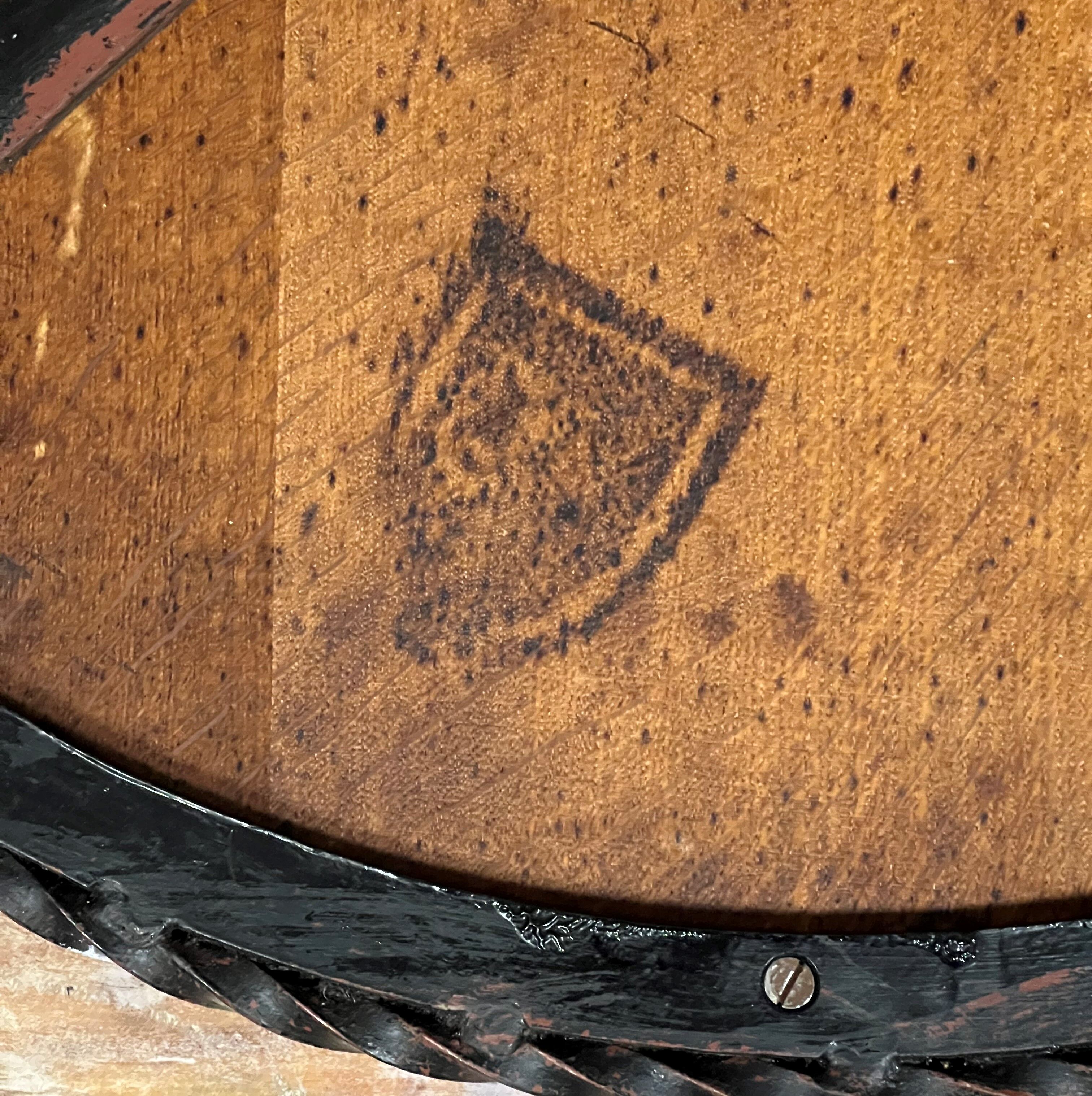 Hammered iron coffee table with circular wooden top