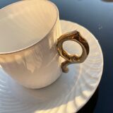 White cups with golden handle