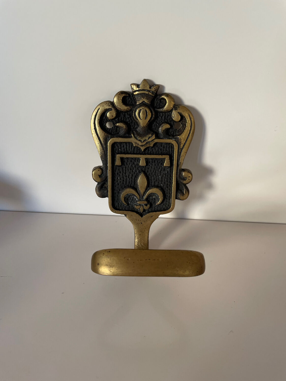 Brass hook fleur-de-lys decoration