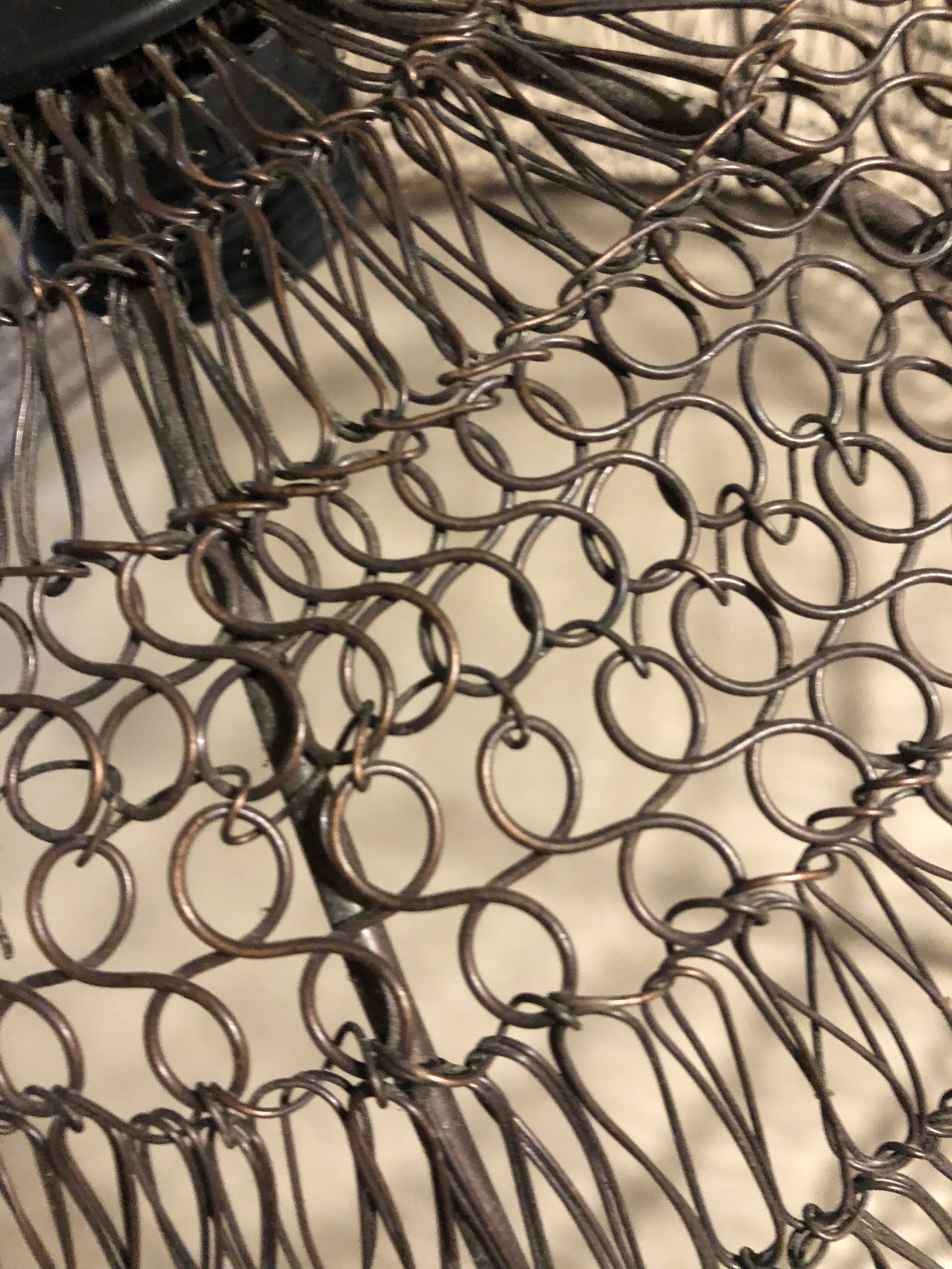 Woven metal suspension