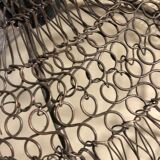Woven metal suspension