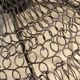 Woven metal suspension