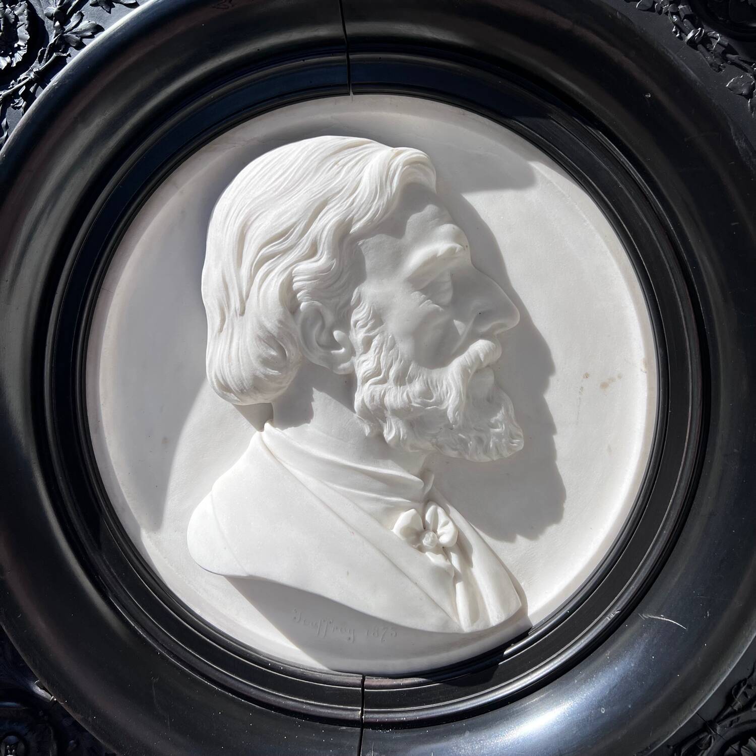 Bas-relief in marble and carved ebony signed Jouffroy, 1873