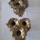 Pair of antique three-branch candlesticks with a floral design.