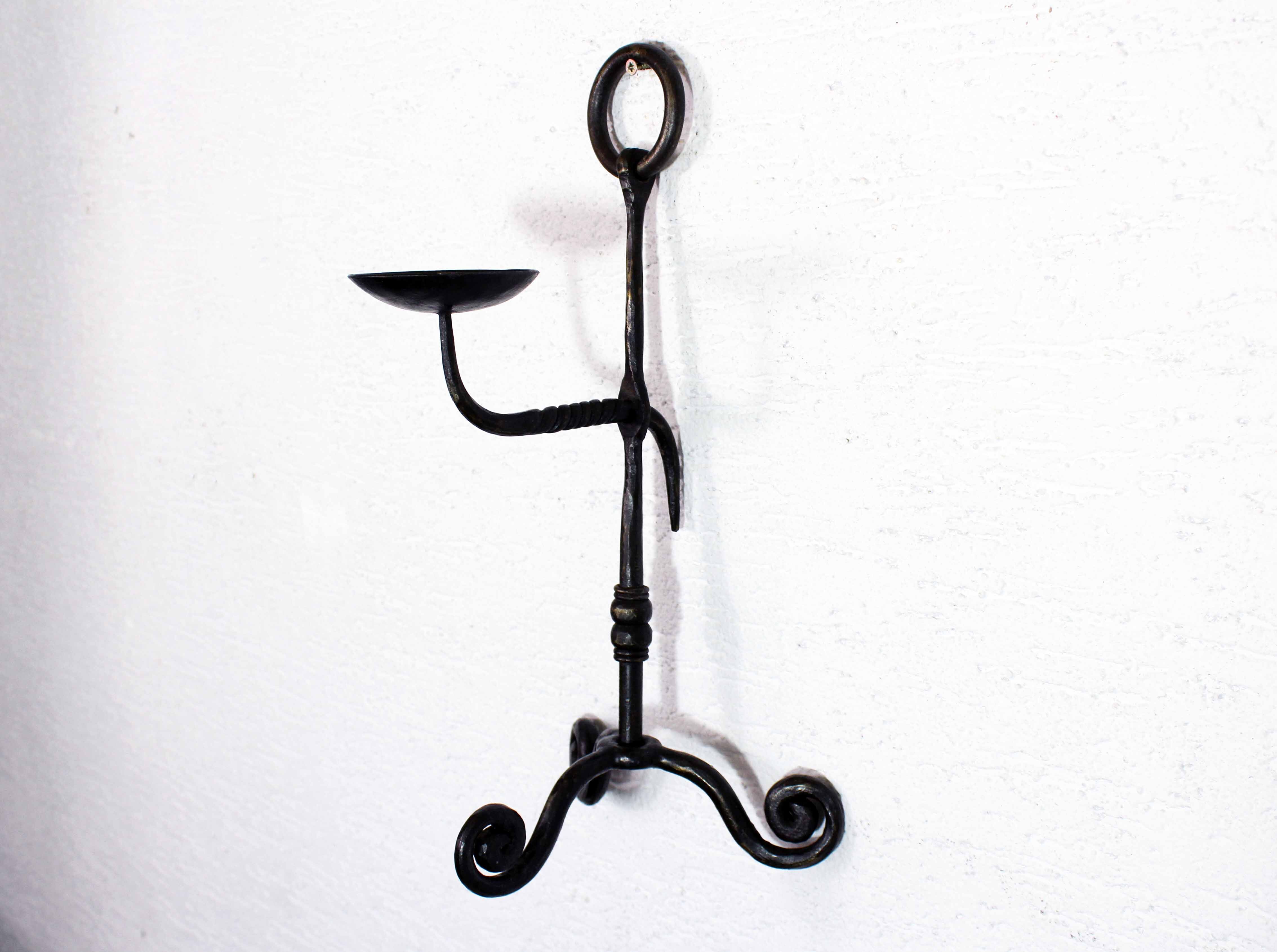 Antique iron candle holder