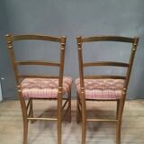 Pair of upholstered chairs in gilded wood