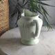 Green ceramic milk jug