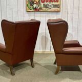 Pair of brown leather wingback Chesterfield armchairs from the 1970s.