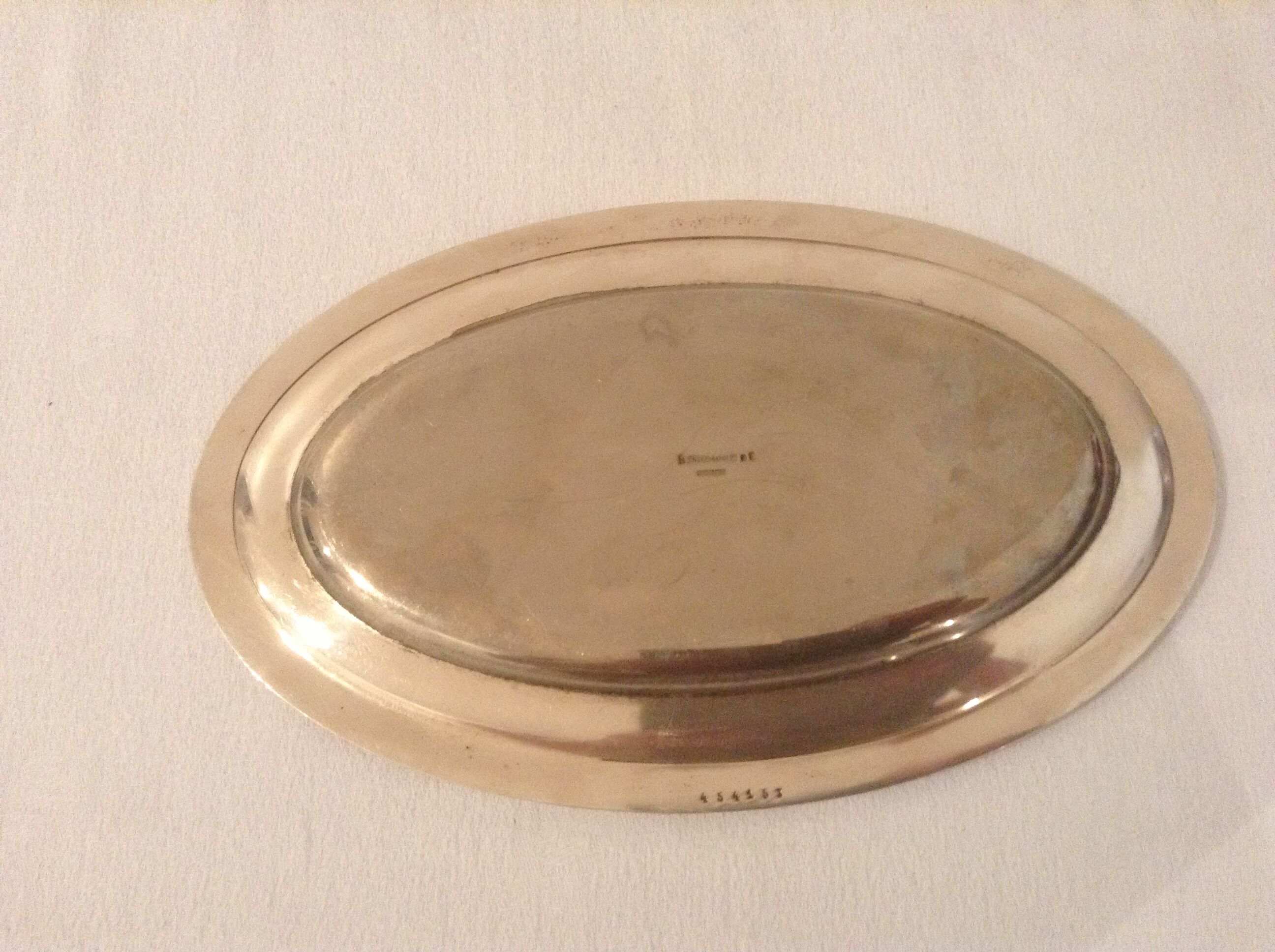 Flat oval silver metal