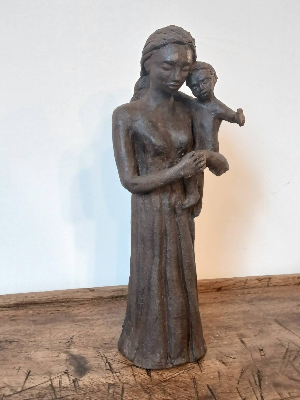Sculpture representing a woman holding a child - original terracotta