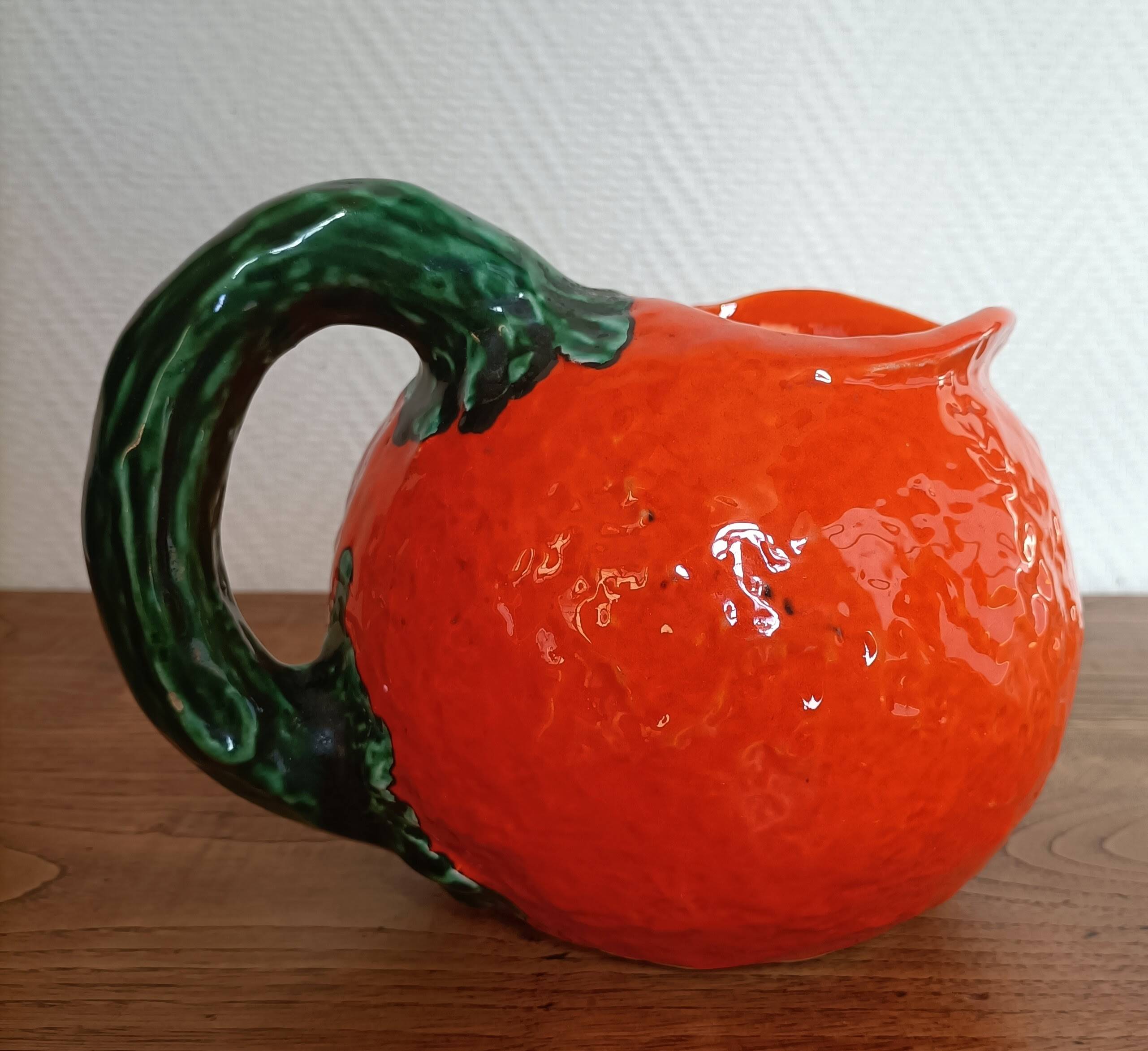 Orange pitcher in Corsican slip