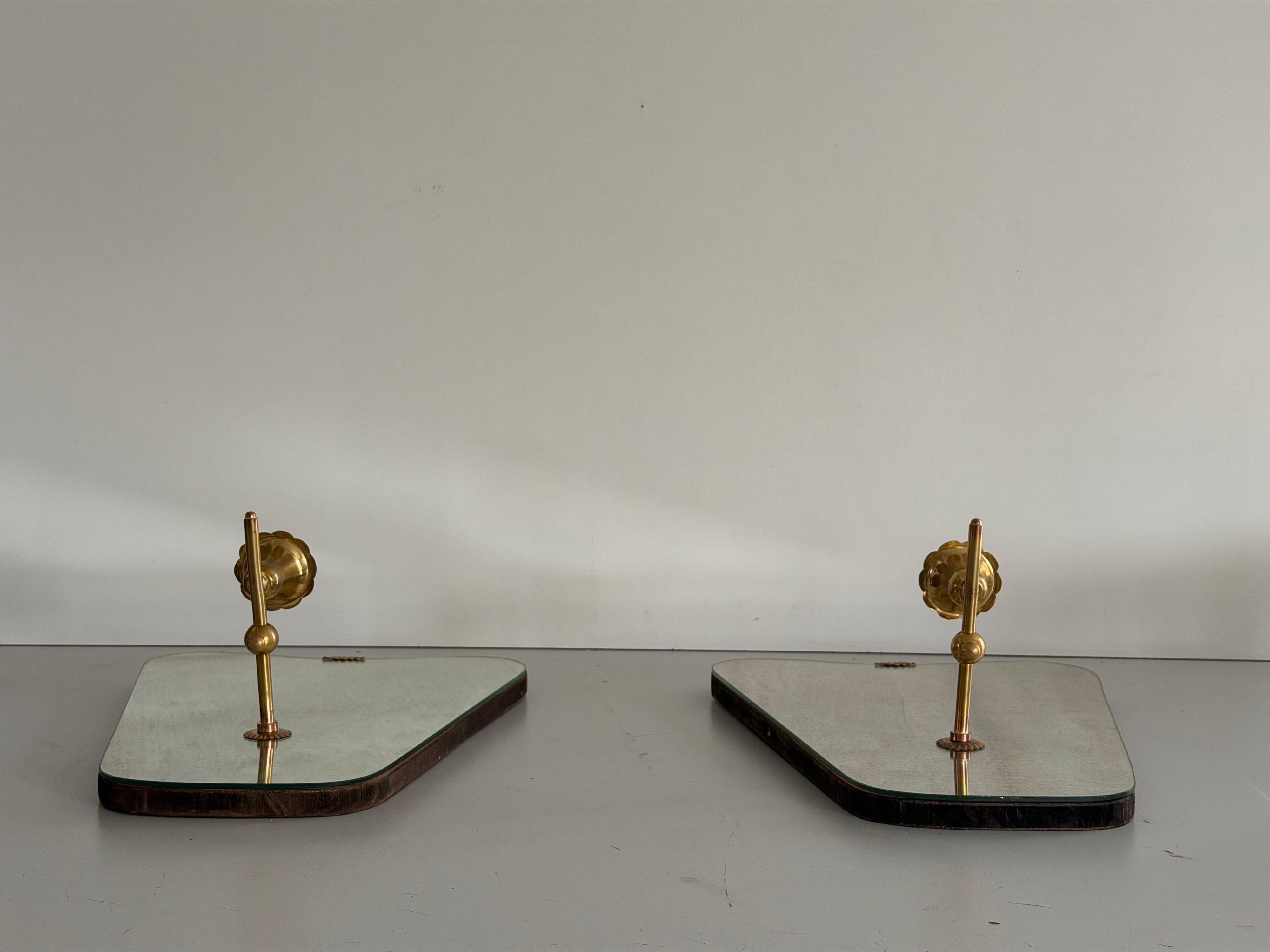 Pair of brass wall lights with mirrors, mid-20th century, Italy, 1960.