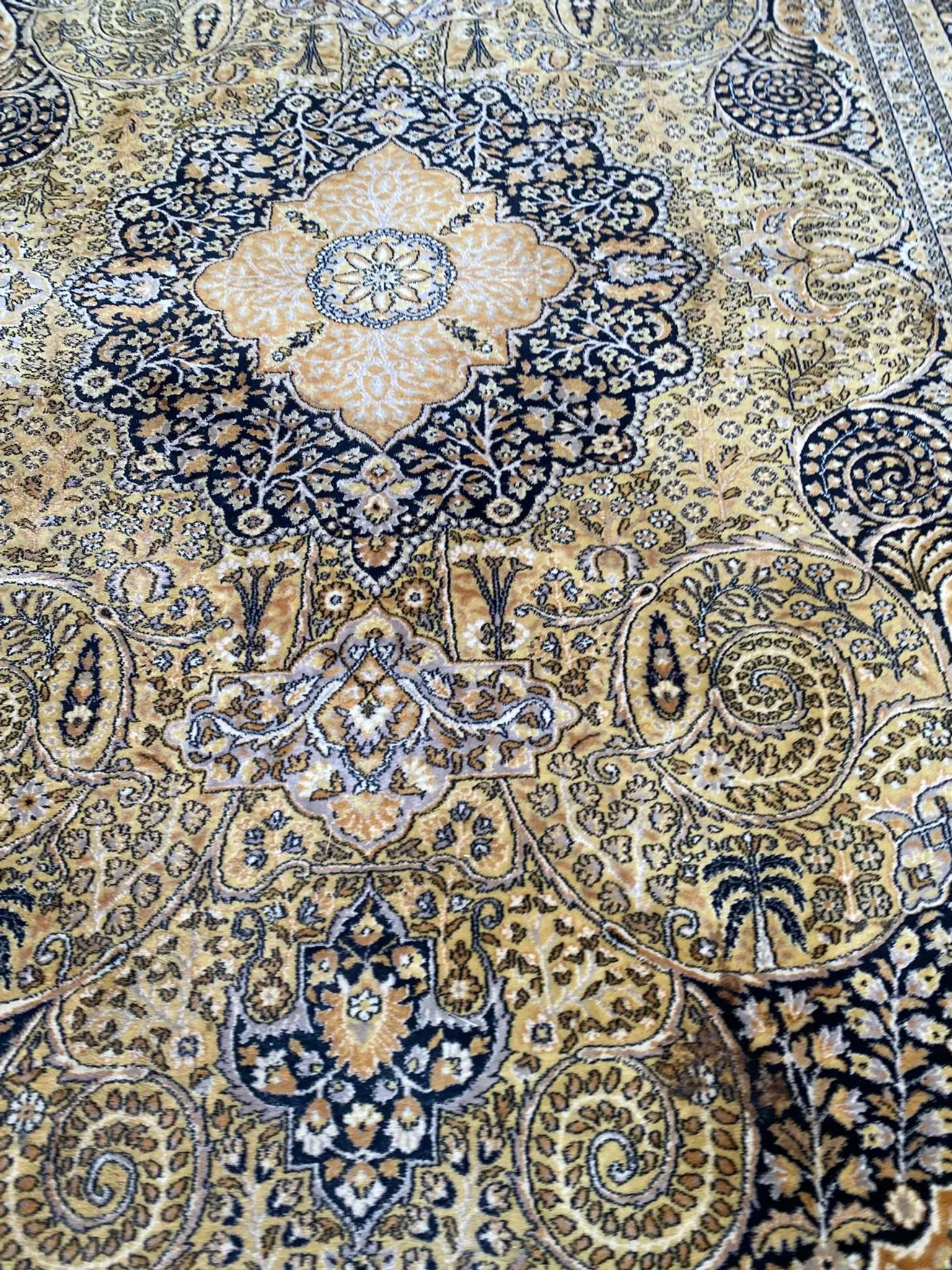 Large Persian wool rug 250x350 cm in gold and navy blue.