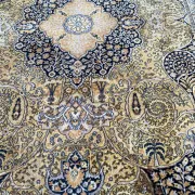 Large Persian wool rug 250x350 cm in gold and navy blue.