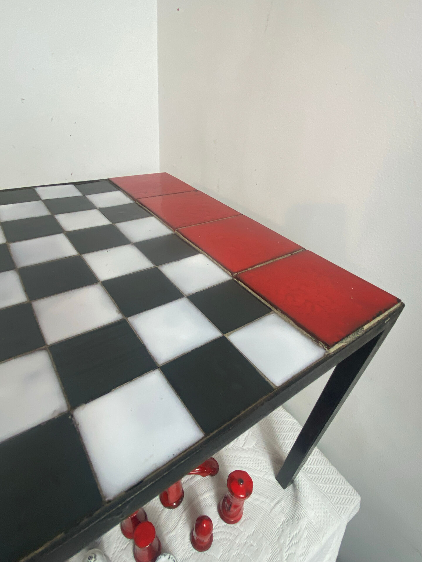 Chess set with ceramic board and pieces.