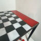 Chess set with ceramic board and pieces.