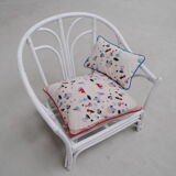 Armchair in rattan with its 2 cushions