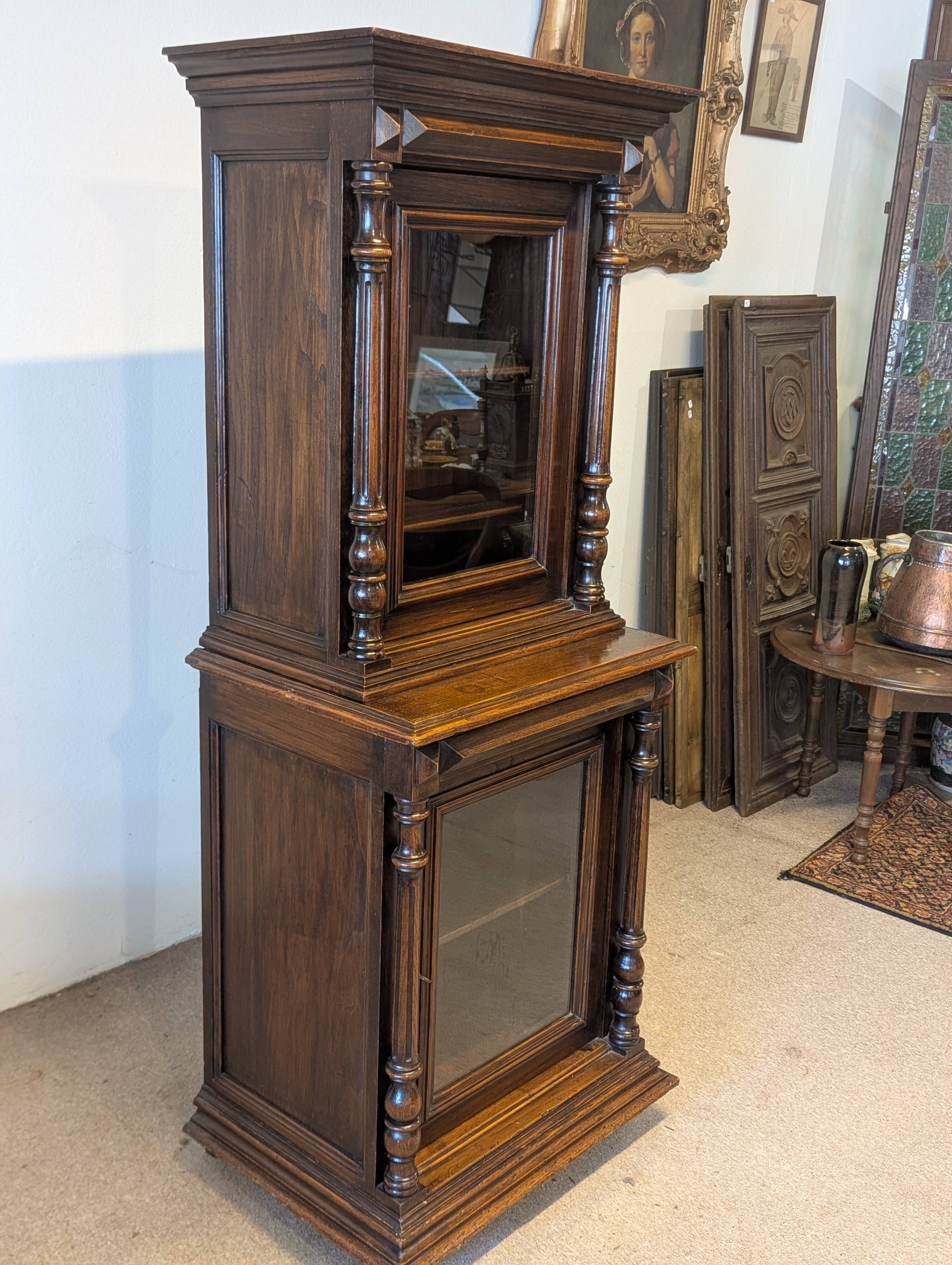 Two-body display cabinet in oak, Henri II style.