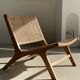 Reclining armchair in natural wood and woven rattan