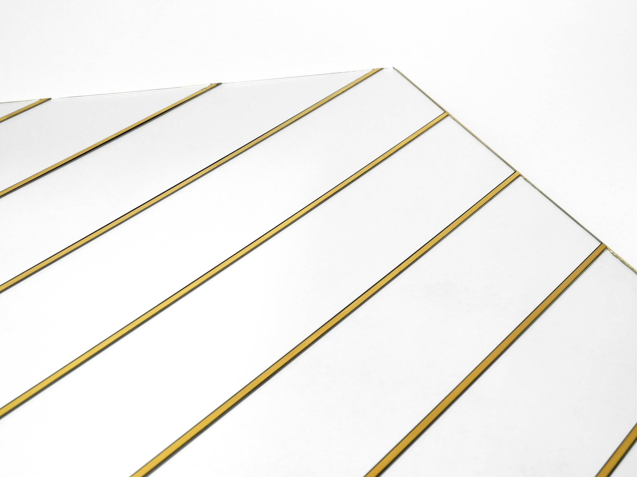 Large, exceptional 1970s brass wall mirror with diagonal mirror strips