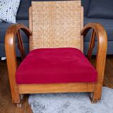 Ancien fauteuil bas colonial style Art Déco en bois.