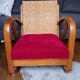 Ancien fauteuil bas colonial style Art Déco en bois.