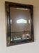 Antique mirror in Napoléon III style, in blackened and gilded wood – original frame.