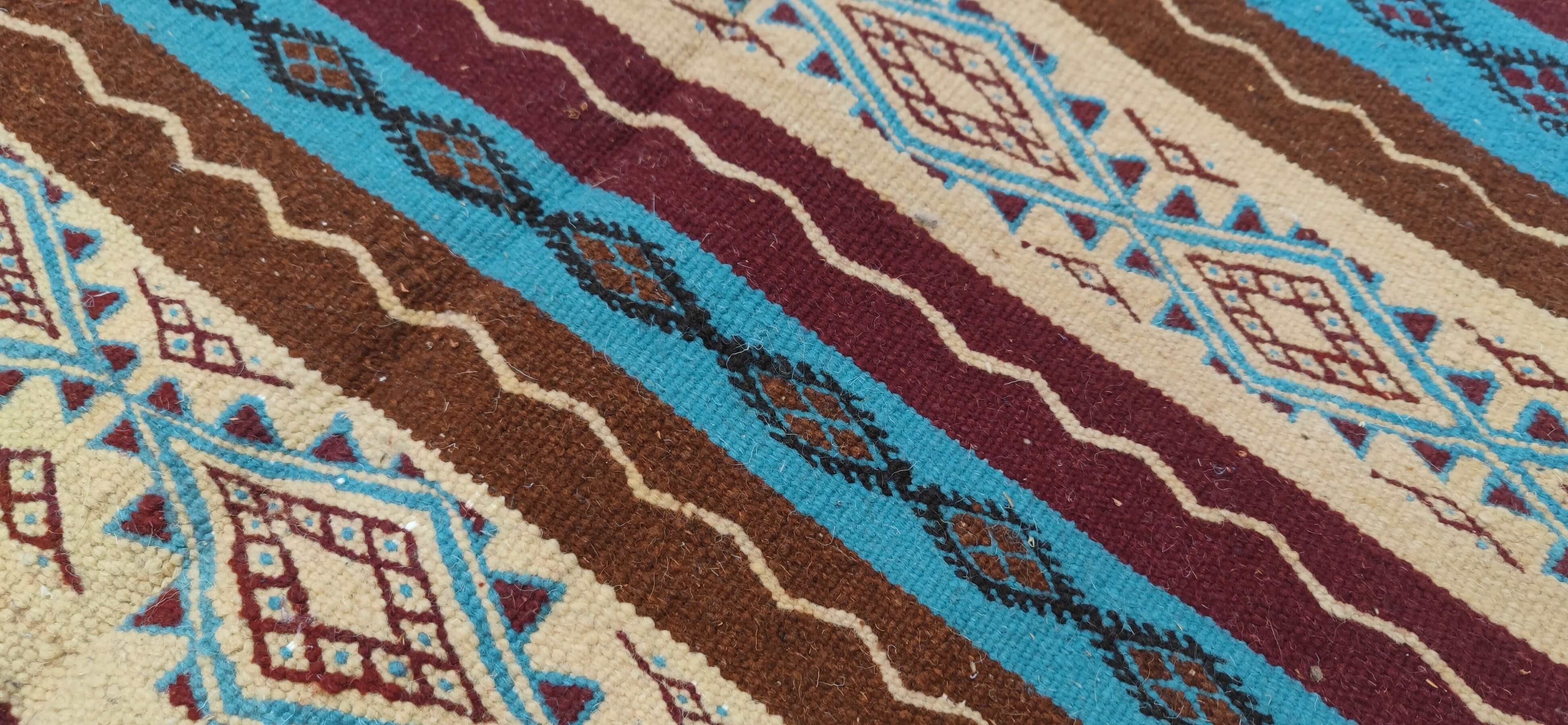 Multicolored hand-woven Berber rugs in natural wool