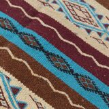 Multicolored hand-woven Berber rugs in natural wool