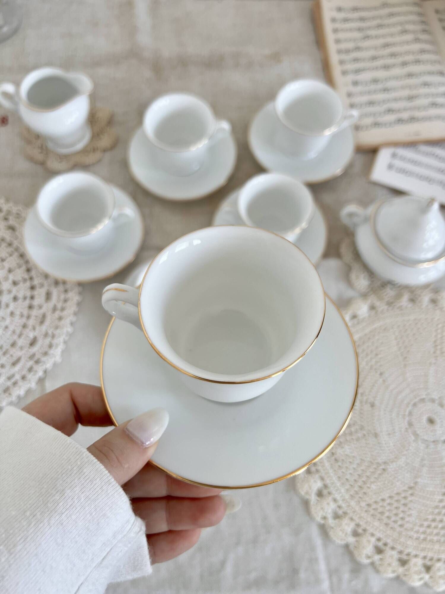 Vintage porcelain tea/coffee service with gold edging for 6 people, sugar bowl and milk jug