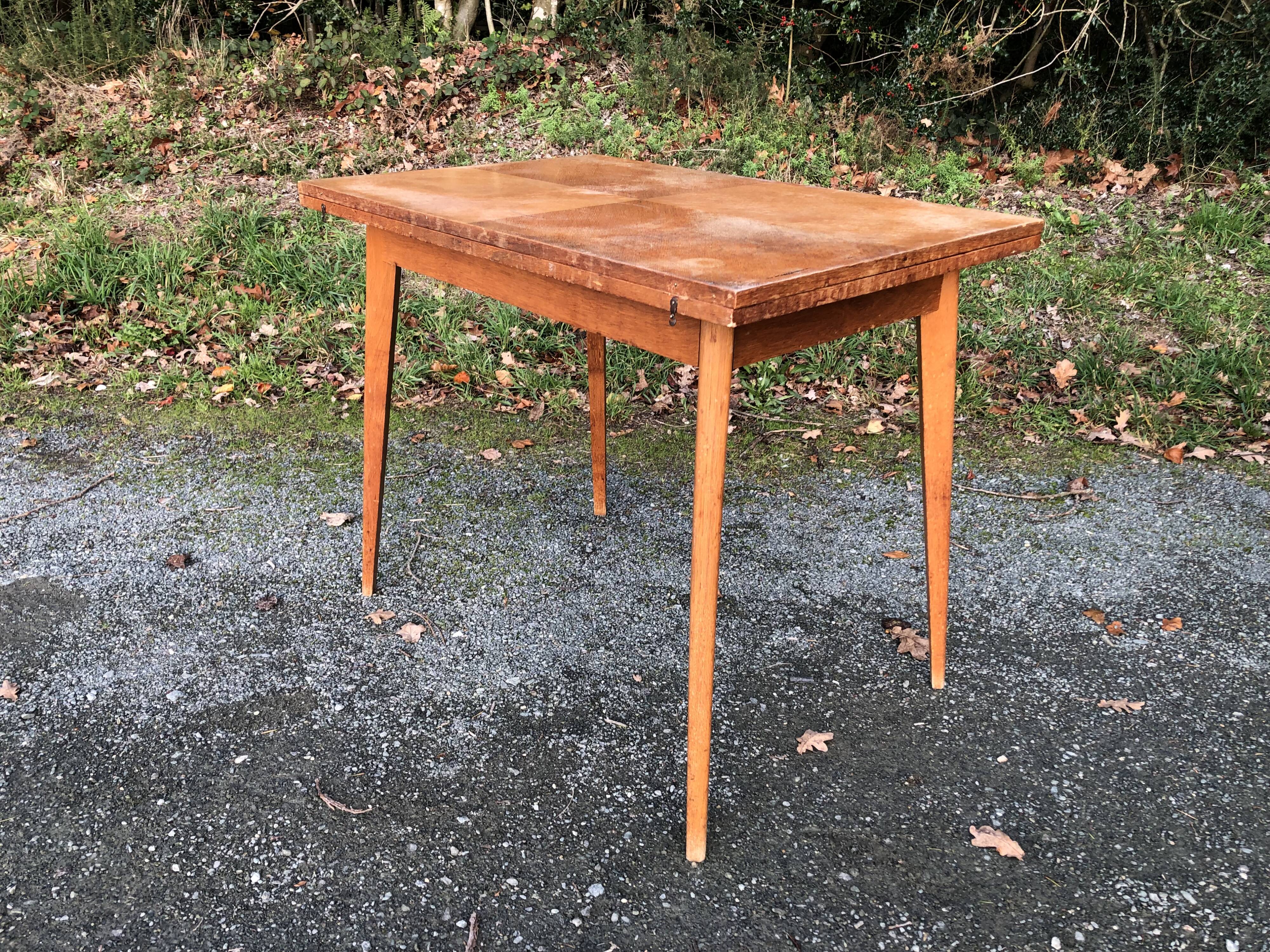 Vintage so-called portfolio table with oak compass base and its oak cp swivel top.