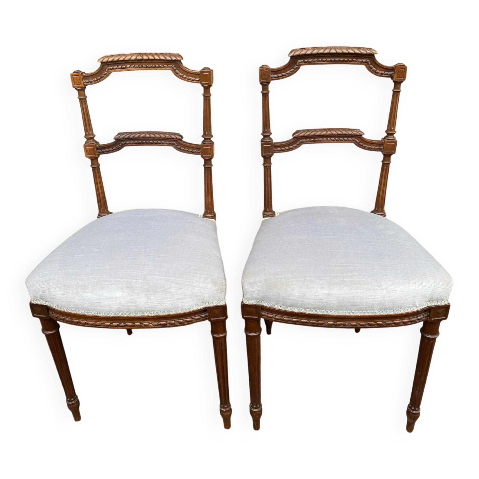 2 Louis XVI period chairs in solid wood and grey fabric.