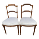 2 Louis XVI period chairs in solid wood and grey fabric.