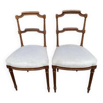 2 Louis XVI period chairs in solid wood and grey fabric.