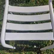 pair of white metal chairs, Tolix style