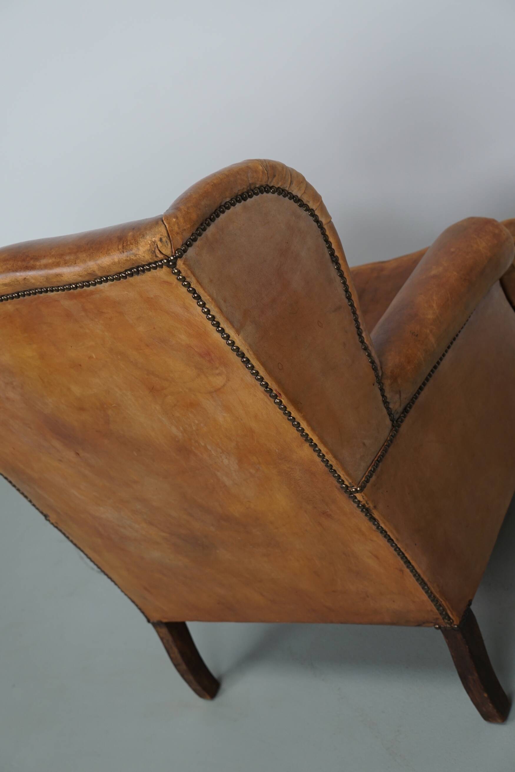 Vintage Dutch cognac coloured leather club chair, with footstool