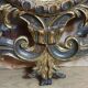 Antique Louis XV style mirror, richly carved with decorations of scrolls, shells, and foliage.