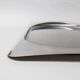 1990s vintage stainless steel platter, rectangular with an oval indentation, minimalist modern design.